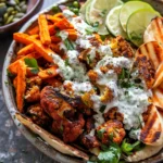 Cauliflower Tzatziki Bowls with Sweet Potato Fries.